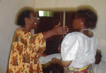 Dr. Gladys Ejomi Martin greets a participant